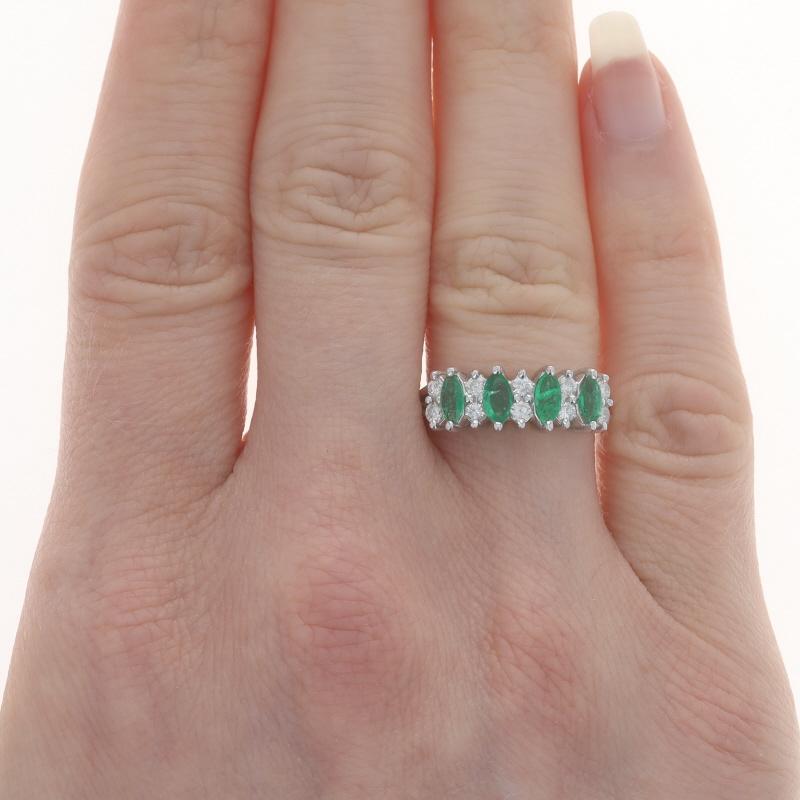 Size: 5 1/2
Sizing Fee: Up 1 1/2 sizes for $35 or Down 1/2 a size for $30

Metal Content: 14k White Gold

Stone Information

Natural Emeralds
Treatment: Oiling
Carat(s): .72ctw
Cut: Marquise
Color: Green

Natural Diamonds
Carat(s): .30ctw
Cut: Round