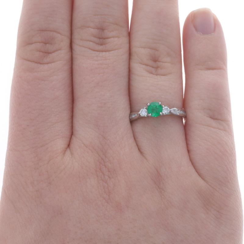 Size: 6 1/4
Sizing Fee: Up 1 1/2 Sizes for $40 or Down 1 1/2 sizes for $35

Metal Content: 18k White Gold

Stone Information

Natural Emerald
Treatment: Oiling
Carat(s): .82ct
Cut: Round
Color: Green

Natural Diamonds
Carat(s): .30ctw
Cut: Round