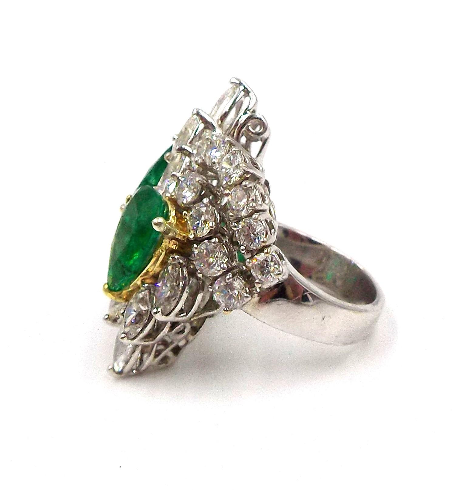 18K white gold, emeralds are ap. 3.62ct in total, tipped by 10 marquise-shaped diamonds, within curved ribbons of 23 round diamonds, altogether ap. 5 cts., ap. 302.37 grams. Size 6.
Marquise-shaped diamonds: H-I-J-one K-VS-SI.
Round diamonds: