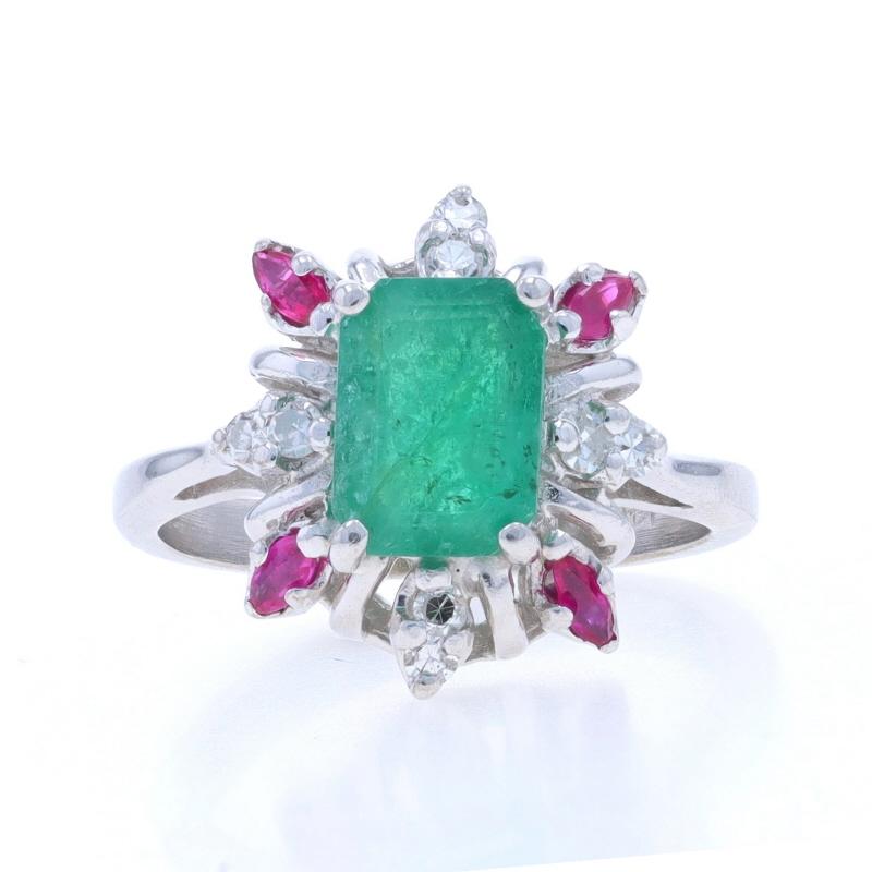 Size: 5 1/4
Sizing Fee: Up 2 sizes for $40 or Down 1 size for $30

Metal Content: 14k White Gold

Stone Information

Natural Emerald
Treatment: Oiling
Carat(s): 1.28ct
Cut: Emerald
Color: Green

Natural Rubies
Treatment: Heating
Carat(s):