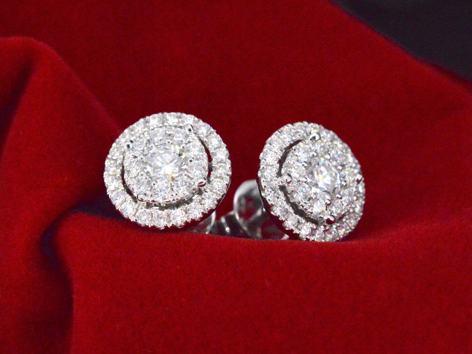 Introducing an exquisite pair of earrings that radiate elegance and sophistication. These earrings feature naturally shiny brilliant-cut diamonds, weighing a total of 1.60 carats. With a color grading of F-G and a purity level of VS, these diamonds
