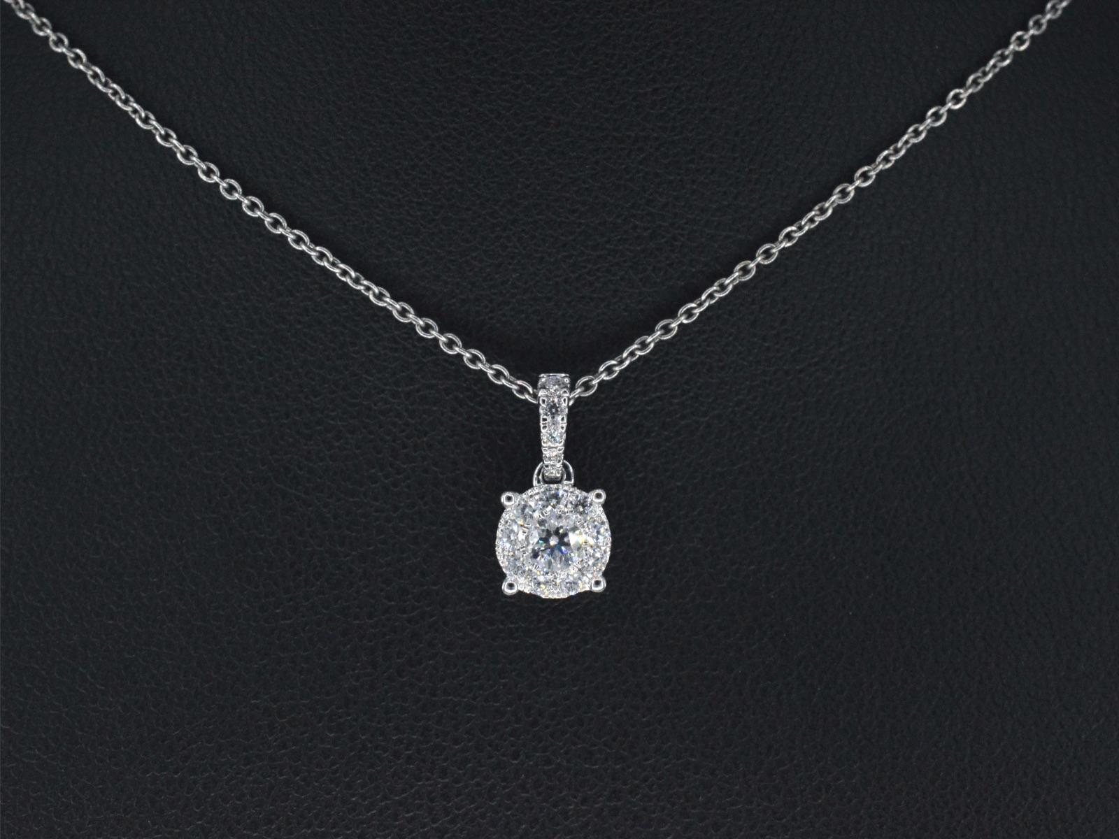This exquisite pendant features naturally shiny diamonds, weighing 0.45 carats, with a brilliant cut that enhances their sparkle. The diamonds boast a color range of F-G, a clarity of VS, and a very good grinding quality, ensuring their
