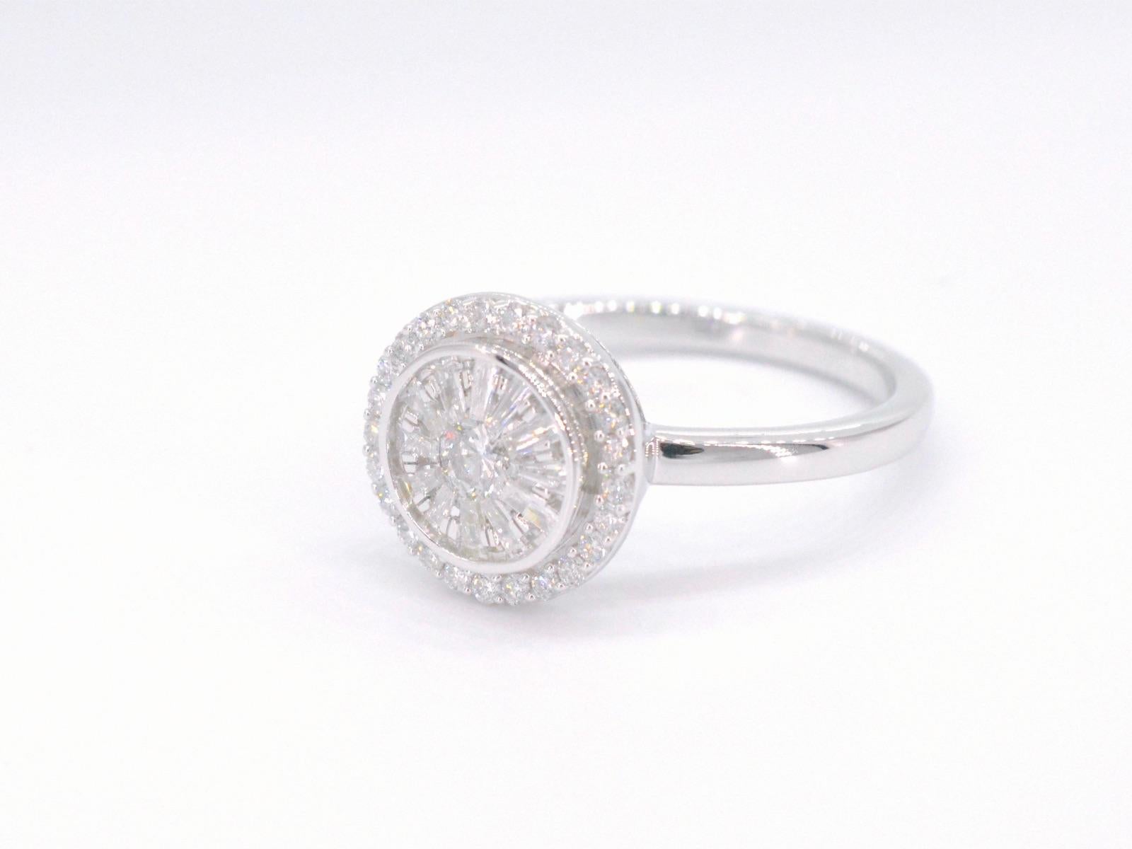 A white gold ring with brilliant and baguette cut diamonds in a round model is a stunning piece of jewelry that exudes luxury and sophistication. The brilliant and baguette cut diamonds are expertly arranged in a round model, creating a striking
