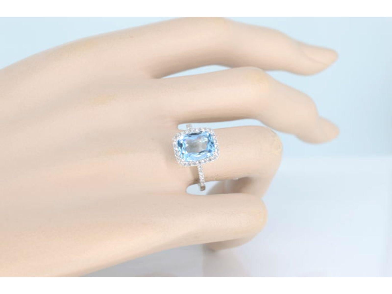 Introducing an exquisite ring that combines the brilliance of diamonds with the vibrant hue of topaz. The ring features naturally shiny diamonds, weighing a total of 0.30 carats. The diamonds are cut in a brilliant style, providing maximum sparkle