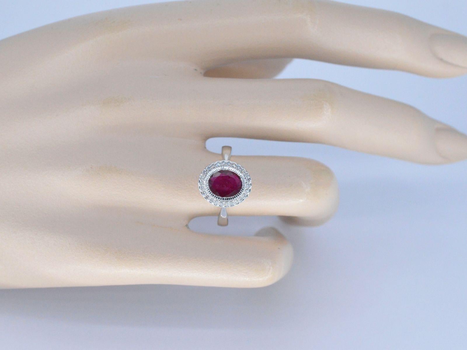 Contemporary White gold entourage ring with diamonds and ruby For Sale