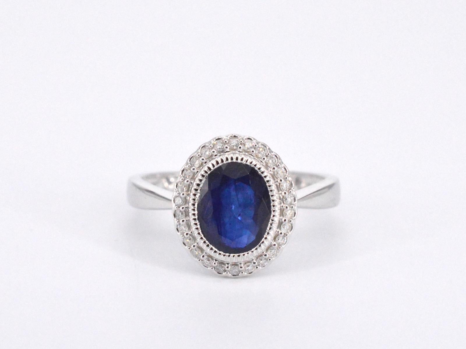 Women's White gold entourage ring with diamonds and sapphire For Sale