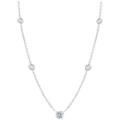 Eighteen Karats Gold Necklace with Five Graduating Bezel-Set Diamonds 