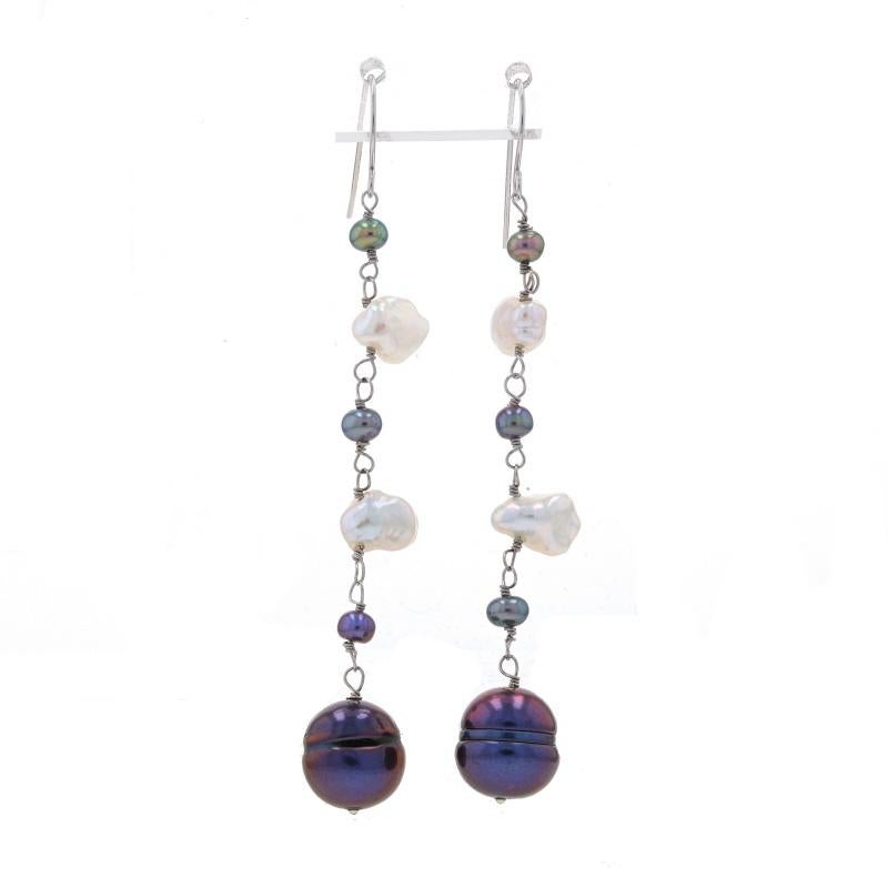 Metal Content: 14k White Gold

Stone Information
Freshwater Pearls
Treatment: Dyed
Color: Purple & White

Style: Dangle
Fastening Type: Fishhook Closures

Measurements
Tall: 2 17/32