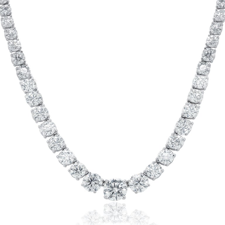 18KT white gold graduated four prong tennis necklace, features 24.35 carats of round brilliant cut diamonds. 
This product comes with a certificate of appraisal
This product will be packaged in a custom box

Composition:
18K white gold
24.35 cts