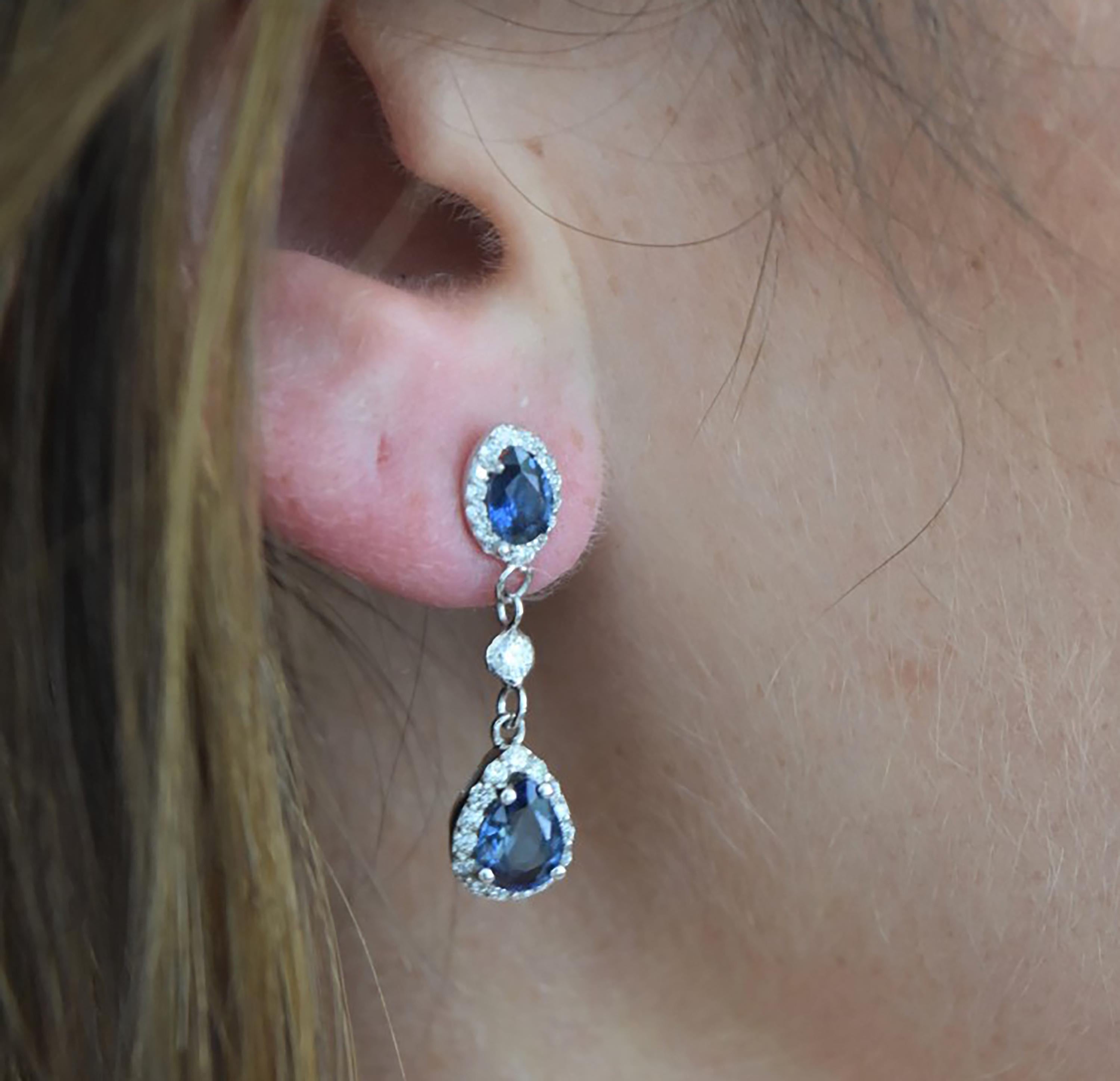 Featuring 14k white gold double halo one inch diamond earrings 
Pear Shape Sapphire weight 3.30 carat 
Diamond weight 1.00
New Earrings
Handmade in USA
Our team of graduate gemologists carefully hand-select every diamond and gemstone
Our design team