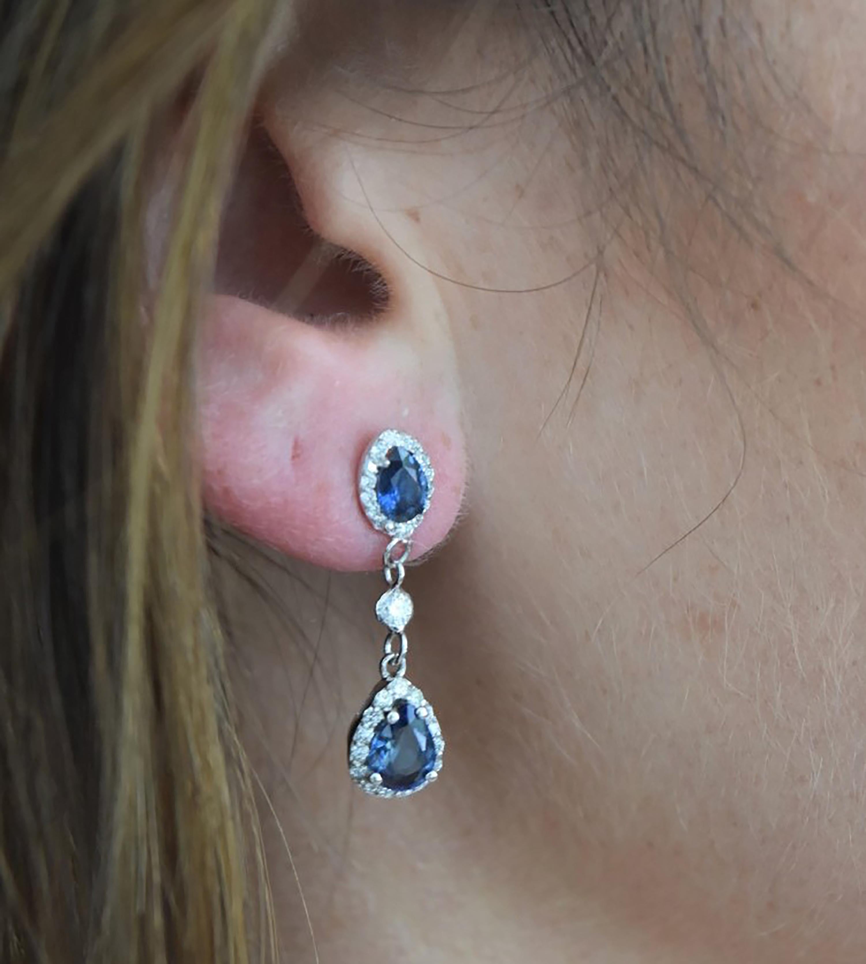 Pear Cut White Gold Halo Pear Shape Sapphire Diamond Drop Earrings Weighing 4.30 Carat