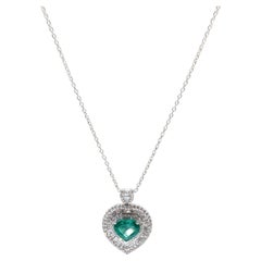 White Gold Heart Shape Pendant w/Heart Shape Emerald Surrounded with Diamonds.