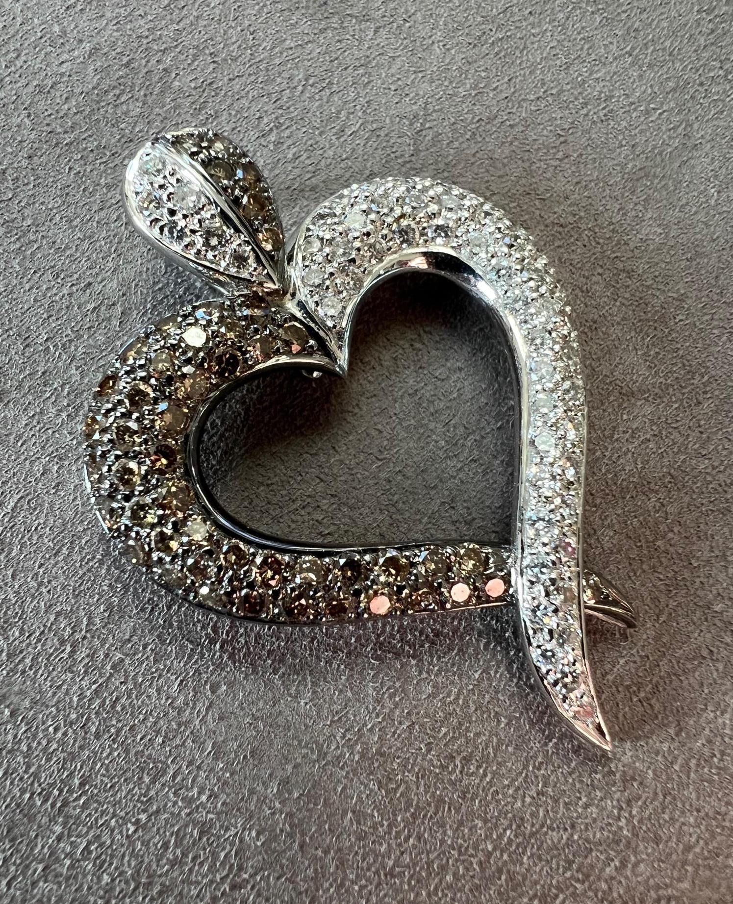 Large detachable white gold and diamond pendant.  This heart shaped design is made in 18k white gold with two different colored diamond sides.  One with white diamonds and the other with bright cognac diamonds. The top bail of the pendant has a