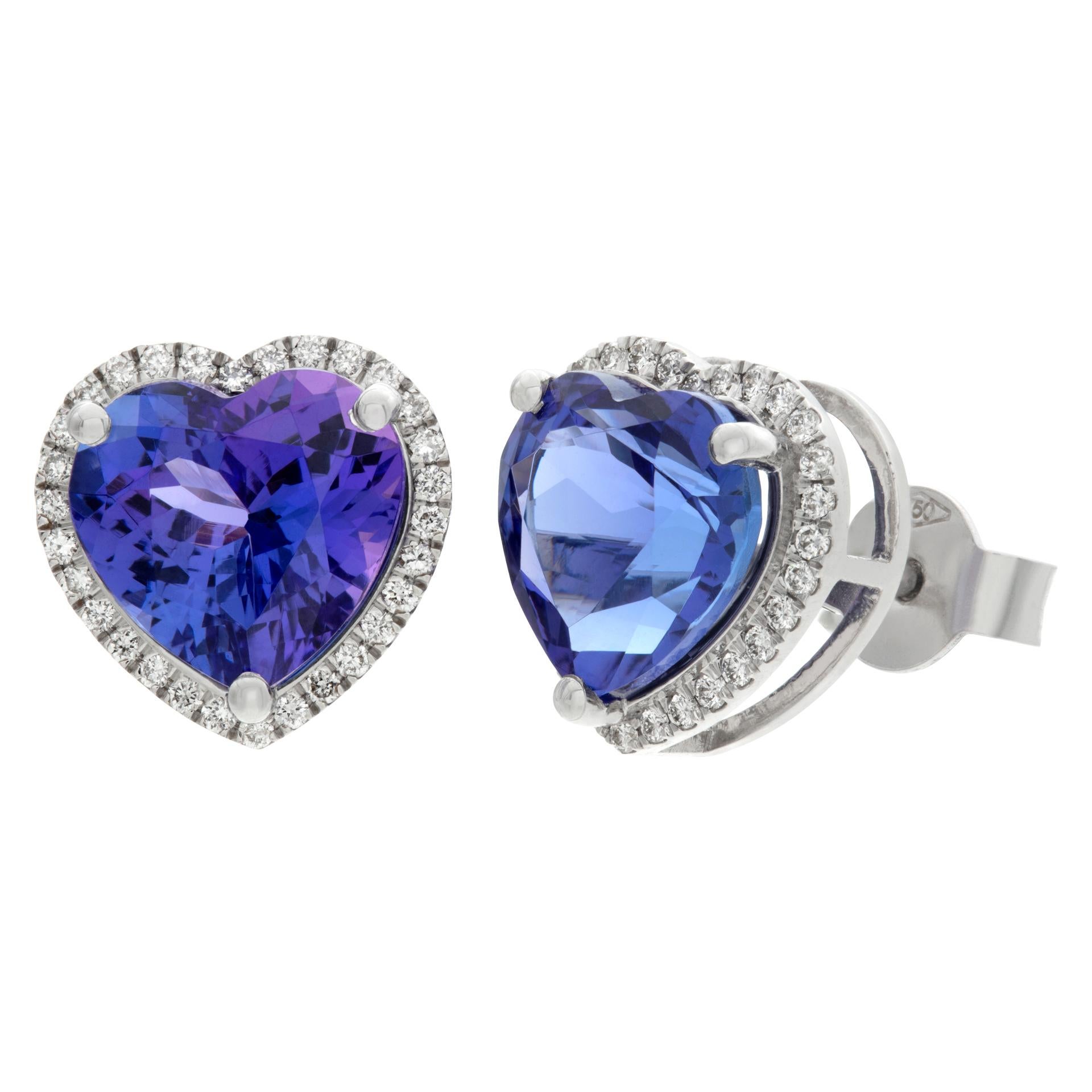 Heart tanzanite and diamonds stud earrings in 18k white gold, with 5.52 carats in purple/blue tanzanite and 0.24 carats in F-G color, VS clarity diamond accents. Size 11mm x 11mm.