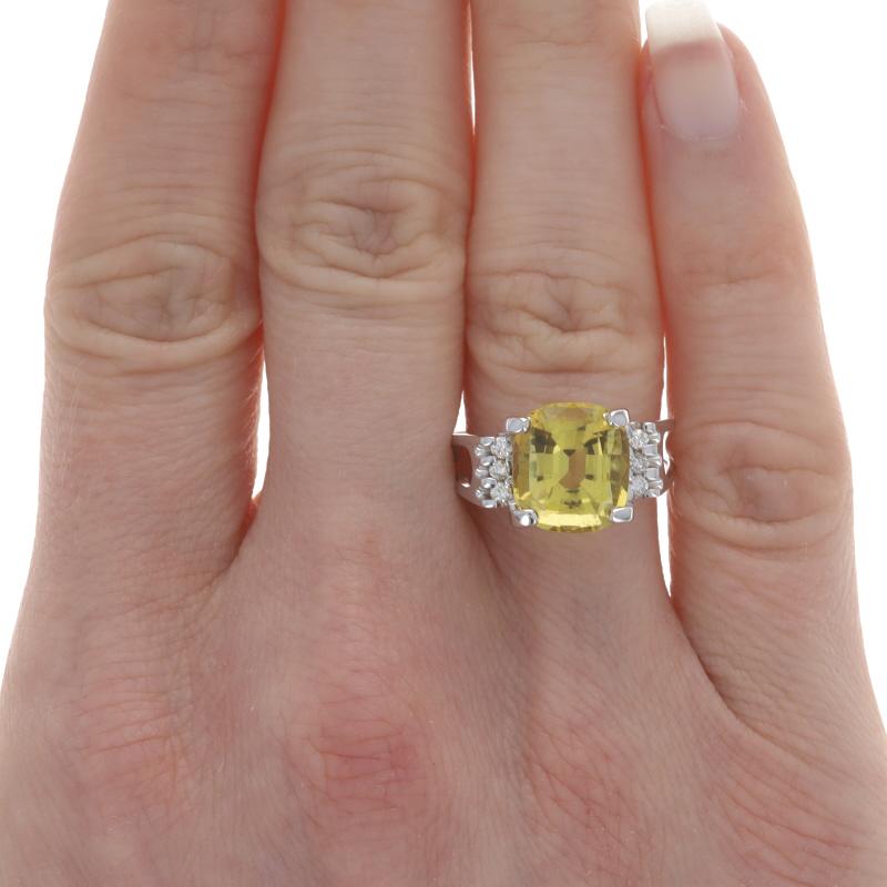 Size: 7 3/4
Sizing Fee: Up 2 sizes for $35 or Down 2 sizes for $35

Metal Content: 14k White Gold

Stone Information
Natural Heliodor / Yellow Beryl
Carat(s): 4.35ct
Cut: Step Cut Cushion

Natural Diamonds
Carat(s): .18ctw
Cut: Round