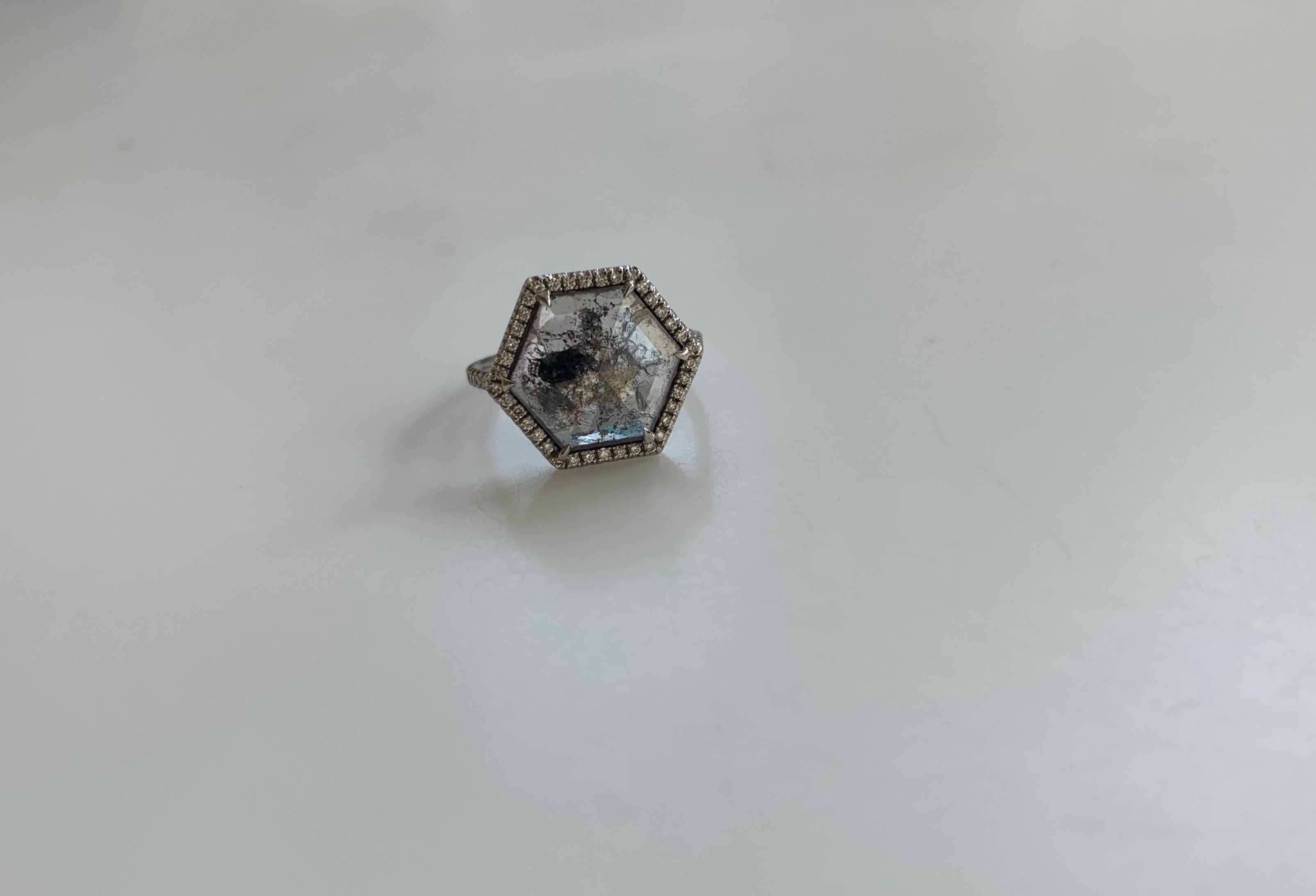 This Ring is 18 Karat White Gold that has been handmade in Los Angeles, CA. The Ring has a 1.85 Carat center Diamond with 0.27 Carats White Diamond pave. This Ring is one of a kind and is a size 2.75