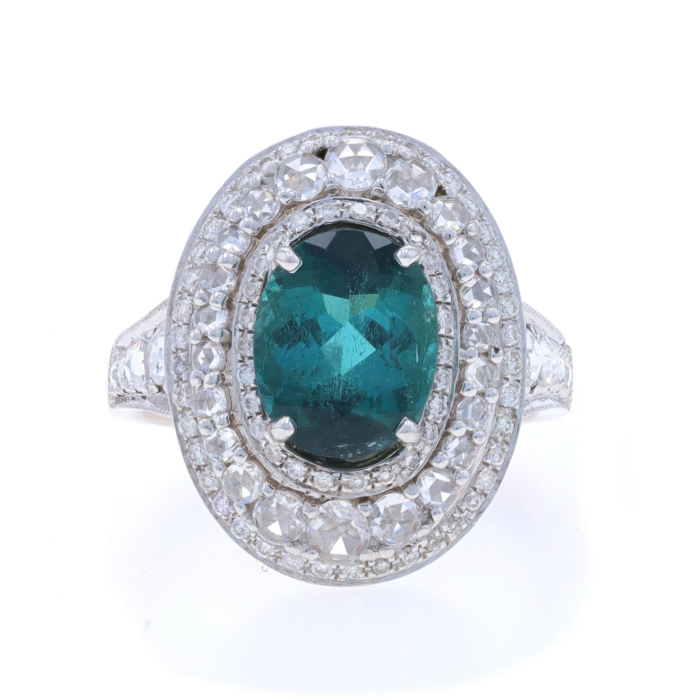Size: 8 3/4
Sizing Fee: Up 2 sizes for $60 or Down 1 size for $40

Metal Content: 18k White Gold

Stone Information

Natural Indicolite Tourmaline
Carat(s): 3.41ct
Cut: Oval
Color: Bluish Green

Natural Diamonds
Carat(s): 1.75ctw
Cut: Rose & Round