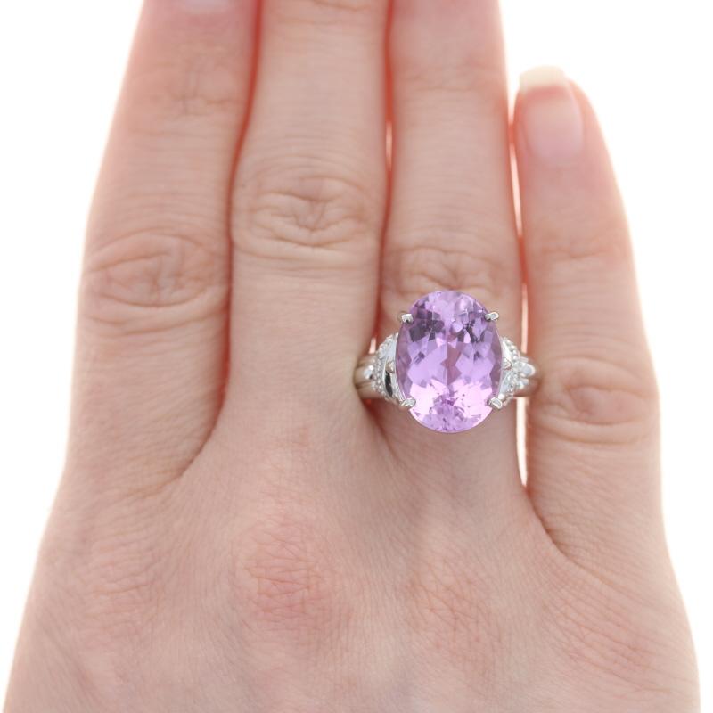 Size: 6 3/4
Sizing Fee: Down 1 for $50 or up 2 for $60

Metal Content: 18k White Gold

Stone Information
Genuine Kunzite
Carat(s): 11.82ctw
Cut: Oval
Color: Purplish Pink

Natural Diamonds
Carat(s): .14ctw
Cut: Single
Color: G - H
Clarity: VS1 -