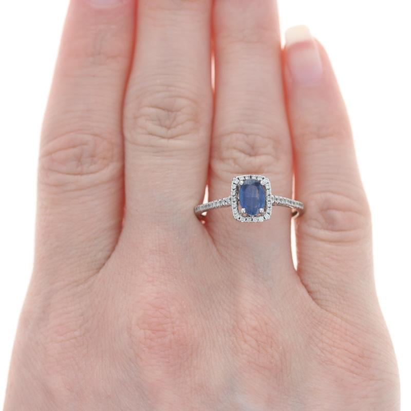 Size: 10 1/4
Sizing Fee: Down or up 2 for $35

Metal Content: 14k White Gold

Stone Information

Natural Kyanite
Carat(s): .90ct
Cut: Oval
Color: Blue

Natural Diamonds
Carat(s): .15ctw
Cut: Round Brilliant
Color: J - K
Clarity: I1 - I2

Total
