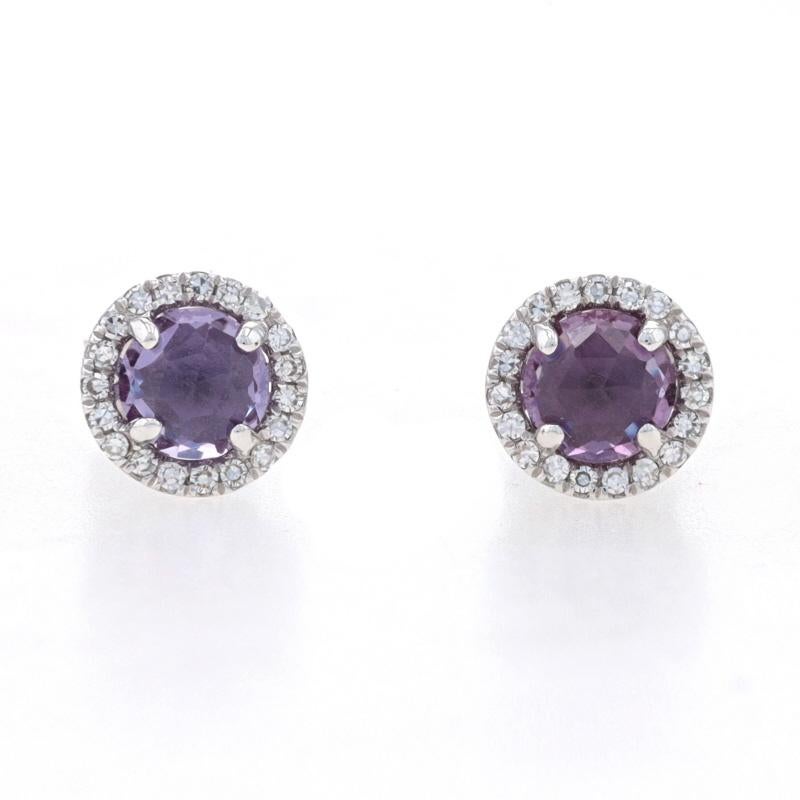 Metal Content: 14k White Gold

Stone Information

Synthetic Alexandrites
Carat(s): .84ctw
Cut: Round Rose
Color: Purple

Natural Diamonds
Carat(s): .08ctw
Cut: Single
Color: F - G
Clarity: VS1 - VS2

Total Carats: .92ctw

Style: Halo Stud
Fastening