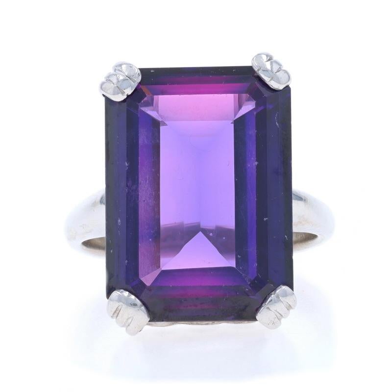 Size: 5 3/4
Sizing Fee: Up 1 size for $40 or Down 1/2 a size for $40

Era: Vintage

Metal Content: 10k White Gold

Stone Information

Lab Grown Sapphire
Treatment: Heating
Carat(s): 16.40ct
Cut: Emerald

Total Carats: 16.40ct

Style: Cocktail