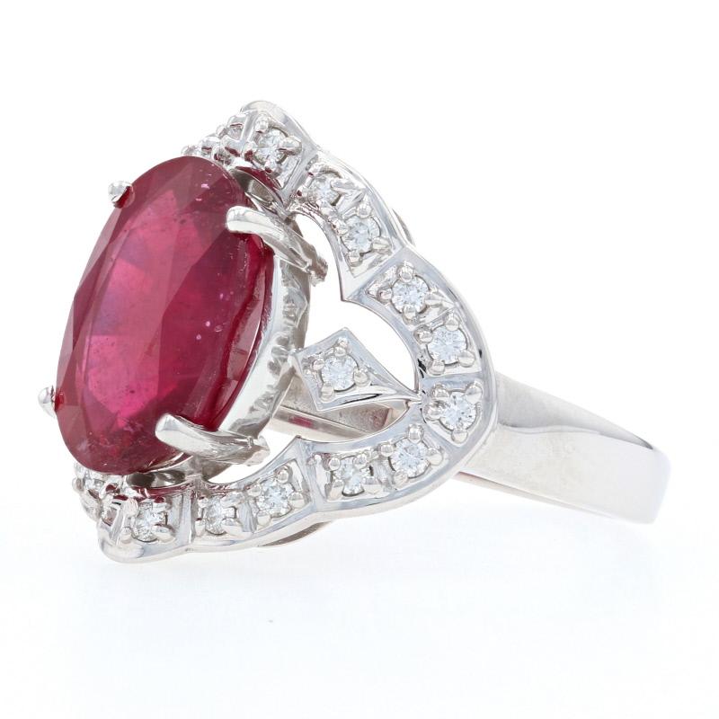 Surprise the queen of your heart with this exquisite gift! Fashioned in 14k white gold, this gorgeous ring showcases a ravishing ruby solitaire highlighted by a sparkling array of natural diamonds set along the ring’s scalloped frame.  

This ring