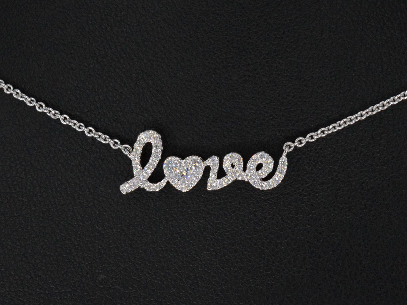 Introducing the exquisite 'Love' Necklace, a dazzling fusion of elegance and sentimentality. This resplendent piece features 52 meticulously crafted diamonds, totaling 0.50 carats. The diamonds boast a brilliant cut, showcasing their extraordinary