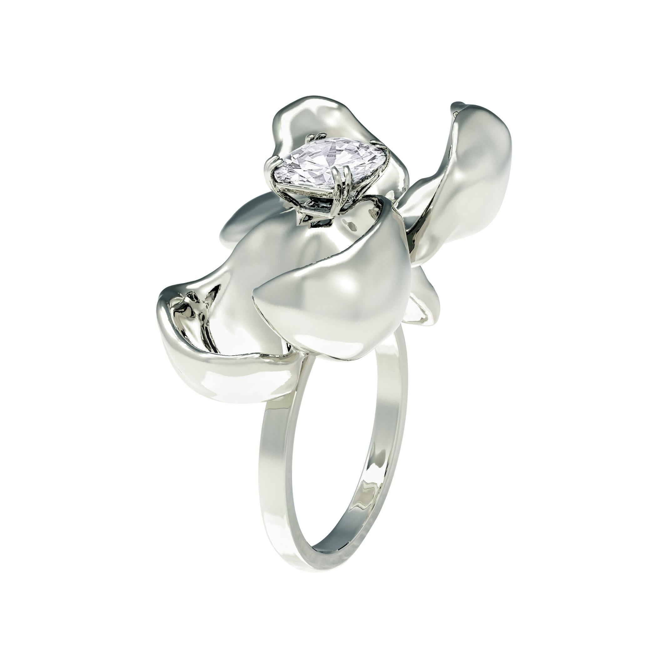 This limited edition Magnolia engagement ring is crafted from 14 karat white gold and features a cushion cut crushed ice diamond. With a weight of 8.59 grams, the ring is heavy and larger than it appears in photos, while the petals' size and shape