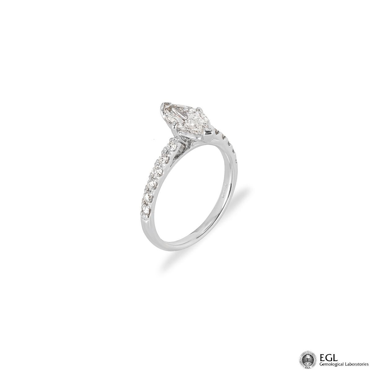 A beautiful 18k white gold diamond engagement ring. The ring is set to the centre with a 1.01ct marquise cut diamond, G colour and SI2 in clarity. Set to either side of the diamond are 6 round brilliant cut pave set diamonds totalling 0.23ct. The