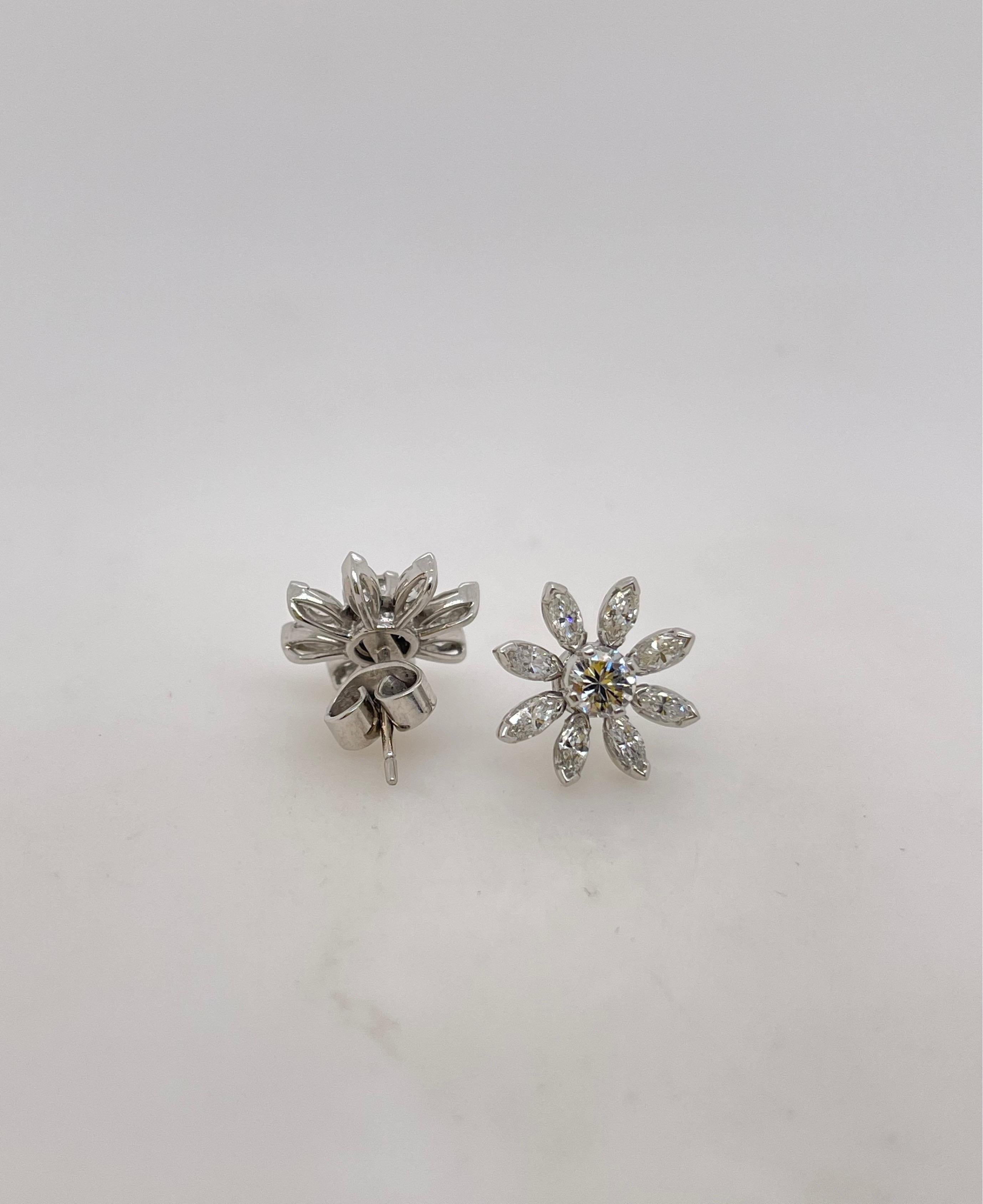 White Gold Marquise & Round Diamond Flower Stud Earrings
Platinum 
2 round diamonds= .58ct VS1 H-1
16 marquise= 1.05ct 
