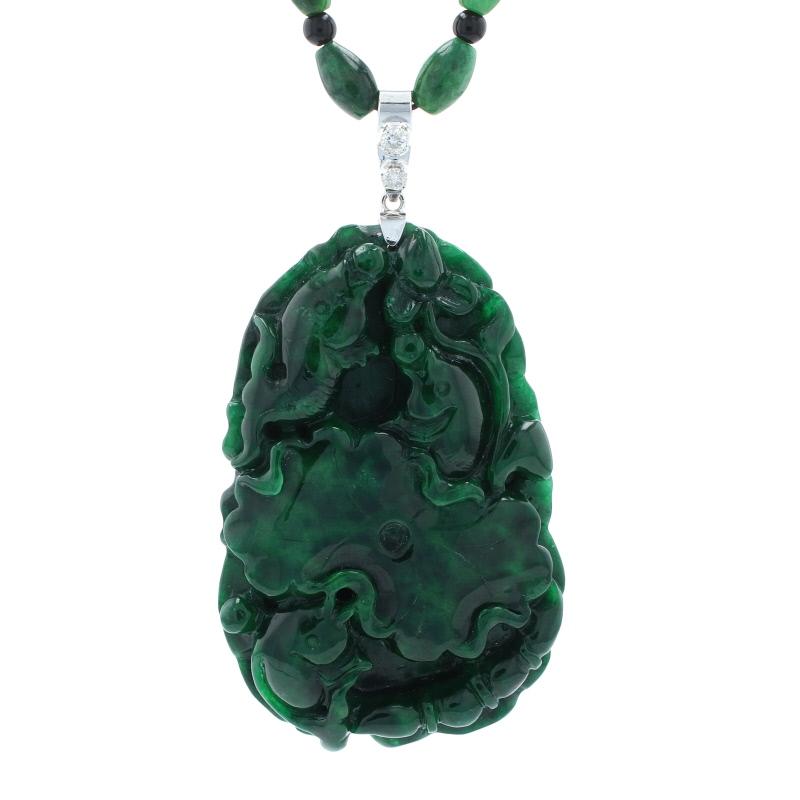 Metal Content: 18k White Gold (pendant) & Stainless Steel (clasp)

Stone Information:
Genuine Carved Maw Sit Sit
Color: Green

Genuine Onyx
Color: Black

Natural Diamonds  
Clarity: SI2 - I1
Color: G - H
Total Carats: 0.20ctw 

Pendant