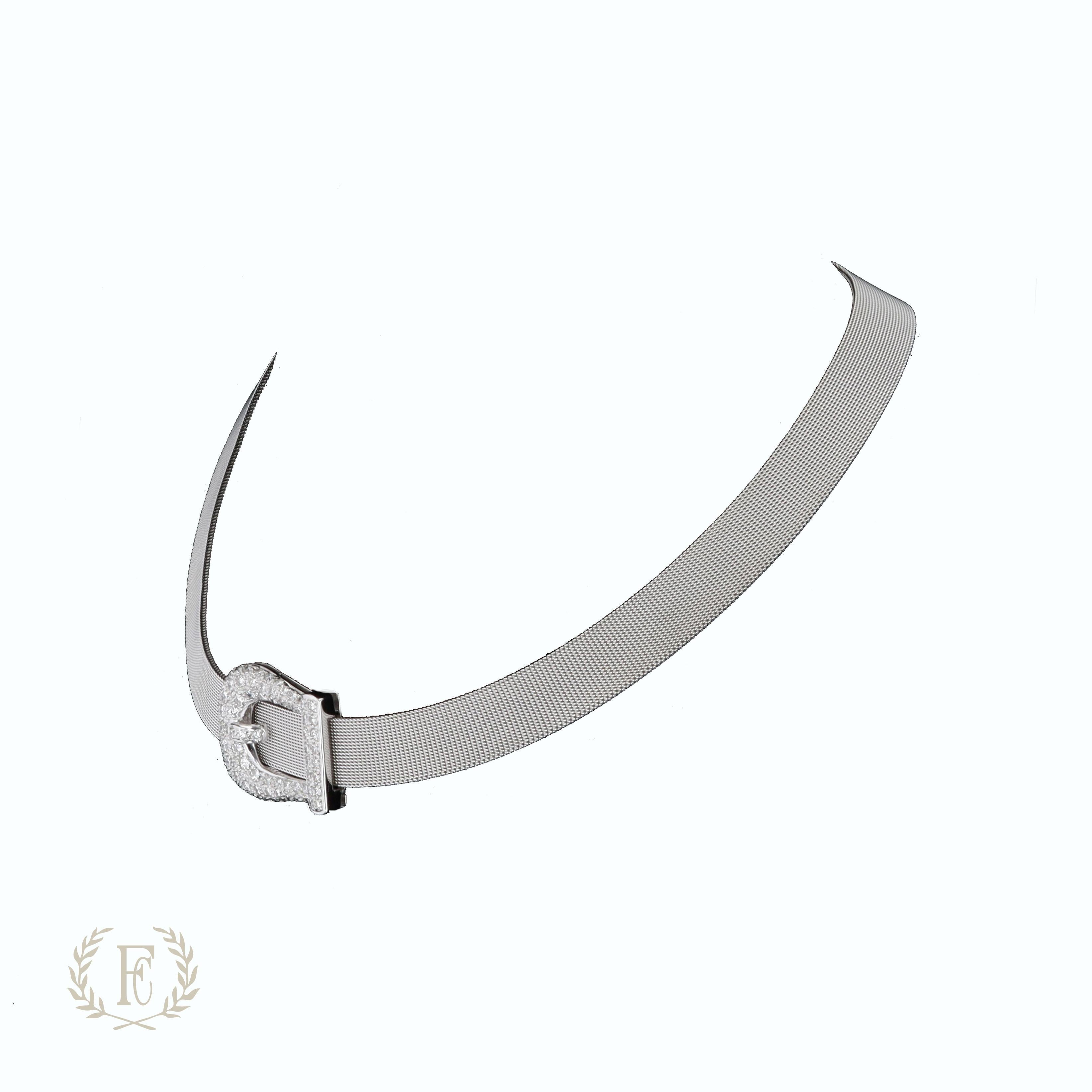 One 18 K white gold mesh and diamond buckle motif collar necklace. The necklace contains 77 brilliant G/H SI1 diamonds weighing 2.00 ctw.