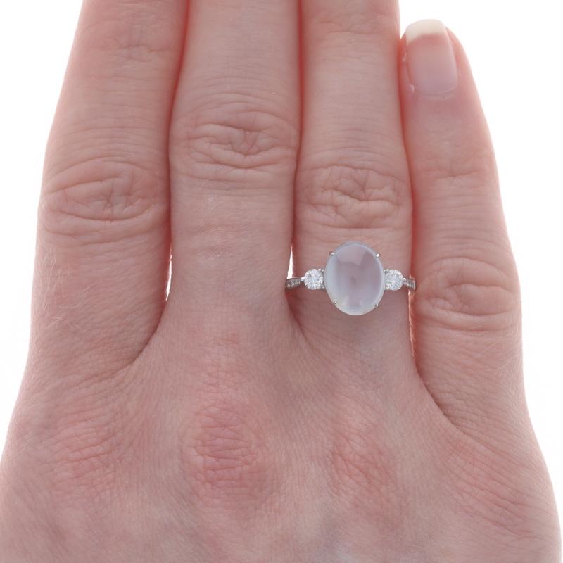 Size: 7 1/2
Sizing Fee: Up 2 sizes for $25 or Down 2 sizes for $25

Metal Content: 18k White Gold

Stone Information
Natural Moonstone
Carat(s): 2.40ct
Cut: Oval Cabochon

Natural Diamonds
Carat(s): .23ctw
Cut: Round Brilliant
Color: F - G
Clarity: