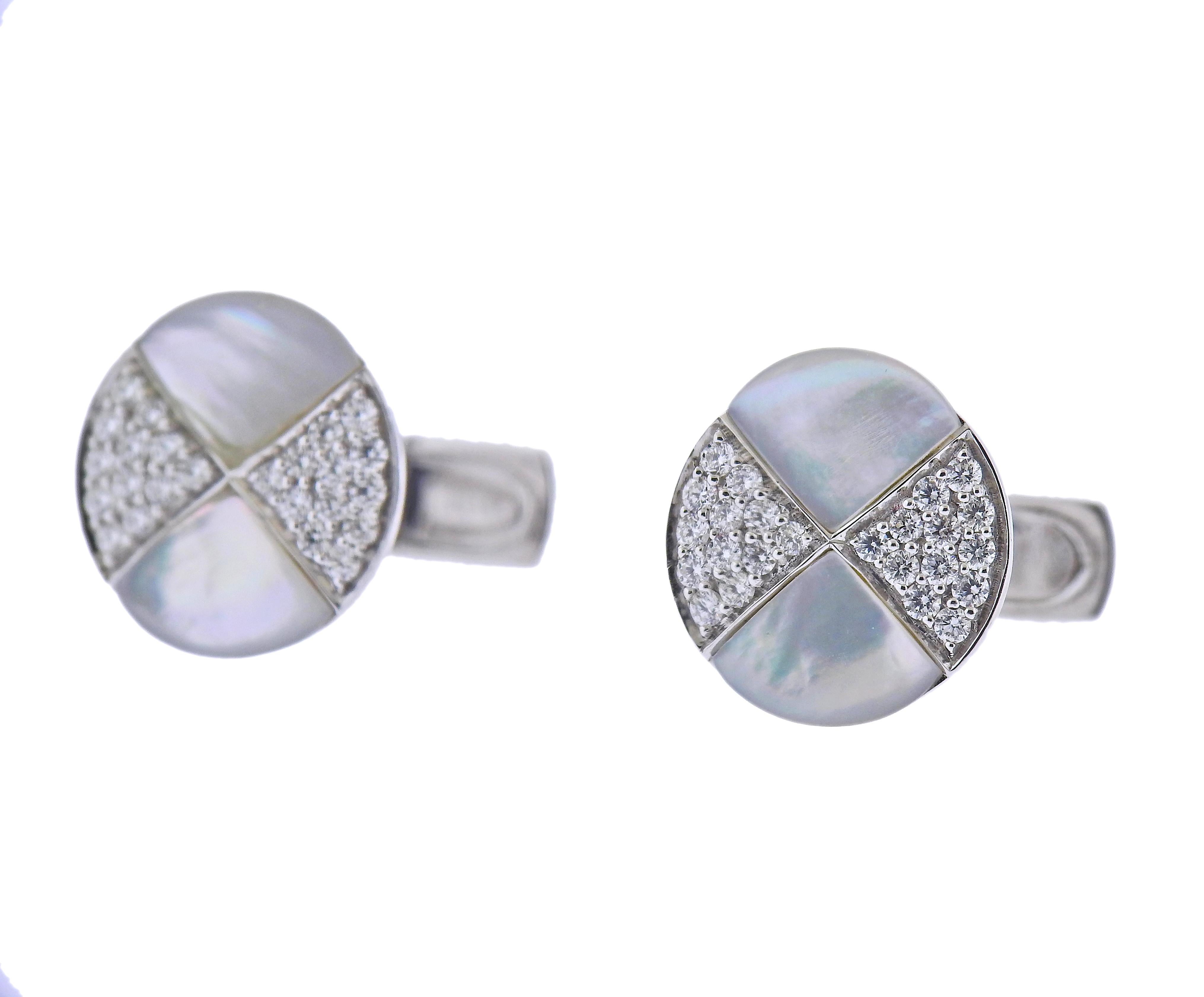 14k White Gold cufflinks. Set with 0.69ctw in SI F/G diamonds and Mother of Pearl. Cufflinks measure 14.5mm x 15mm. Marked - Eravos, 14k. Weight - 8 grams. 
