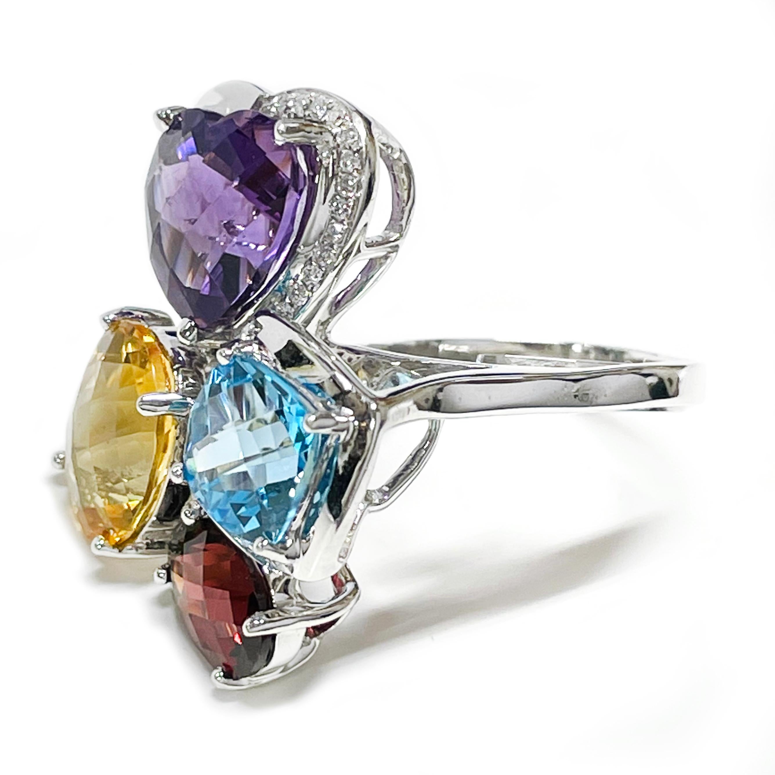14 Karat White Gold Multi-Gemstone Diamond Ring. The cluster ring features a heart-shaped Amethyst, oval-cut Citrine, cushion-cut blue Topaz, oval-set Garnet and round melee diamonds. There is a total of thirty-one melee diamonds that adorn half the