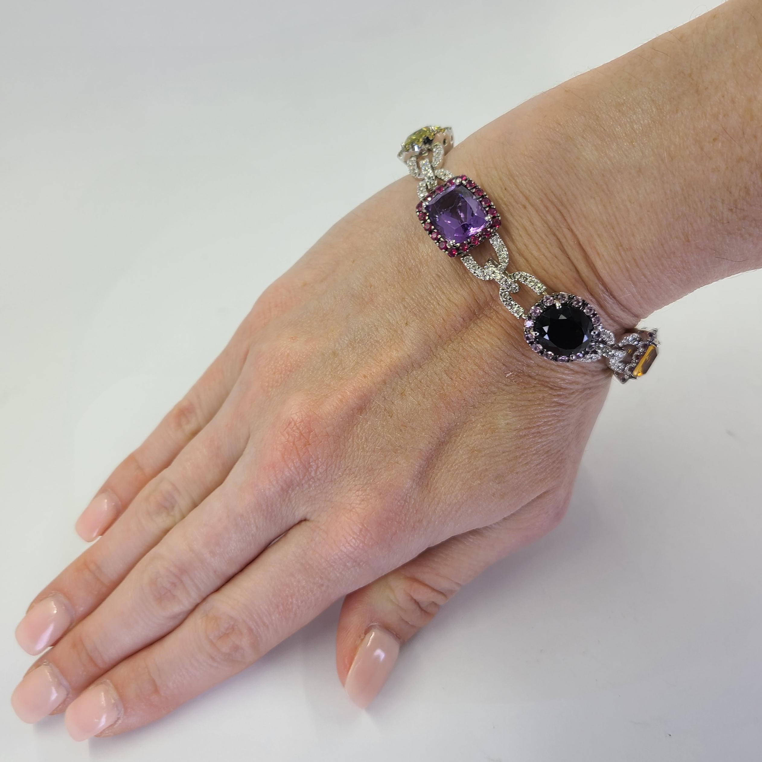 18 Karat White Gold Multicolor Gemstone Bracelet Featuring Sapphire, Amethyst, Ruby, Citrine, Lemon Citrine, Smokey Quartz, & Blue Topaz Totaling Approximately 36 Carats Accented By 1.56 Carat Total Weight Diamonds Of VS Clarity & Top Light Brown