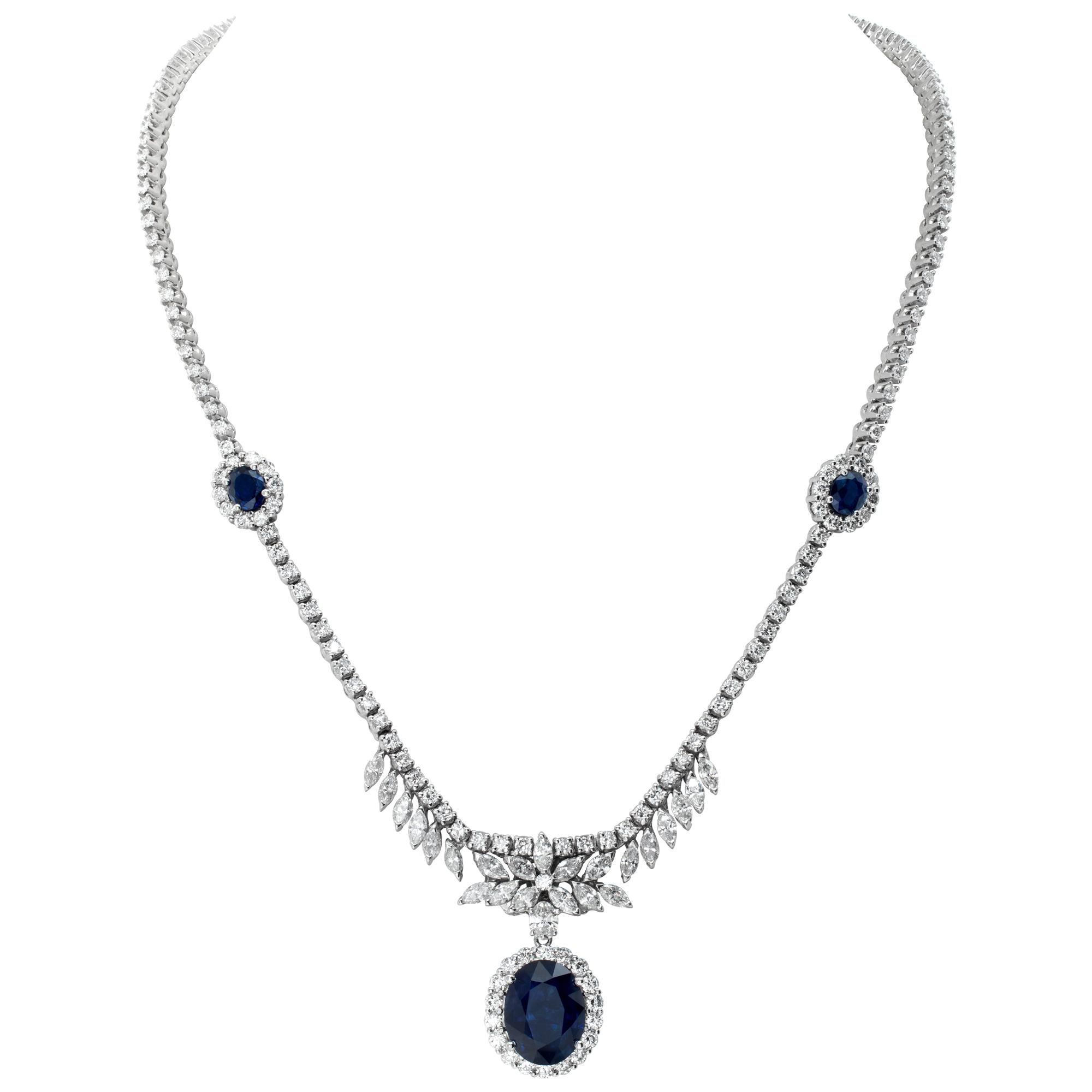 Beautiful 18k white gold necklace with 10.2 carats in round, marquise, and oval cut diamonds (G-H Color, VS Clarity) and 9.05 carats in deep blue oval cut sapphires. Length 17 inches.
