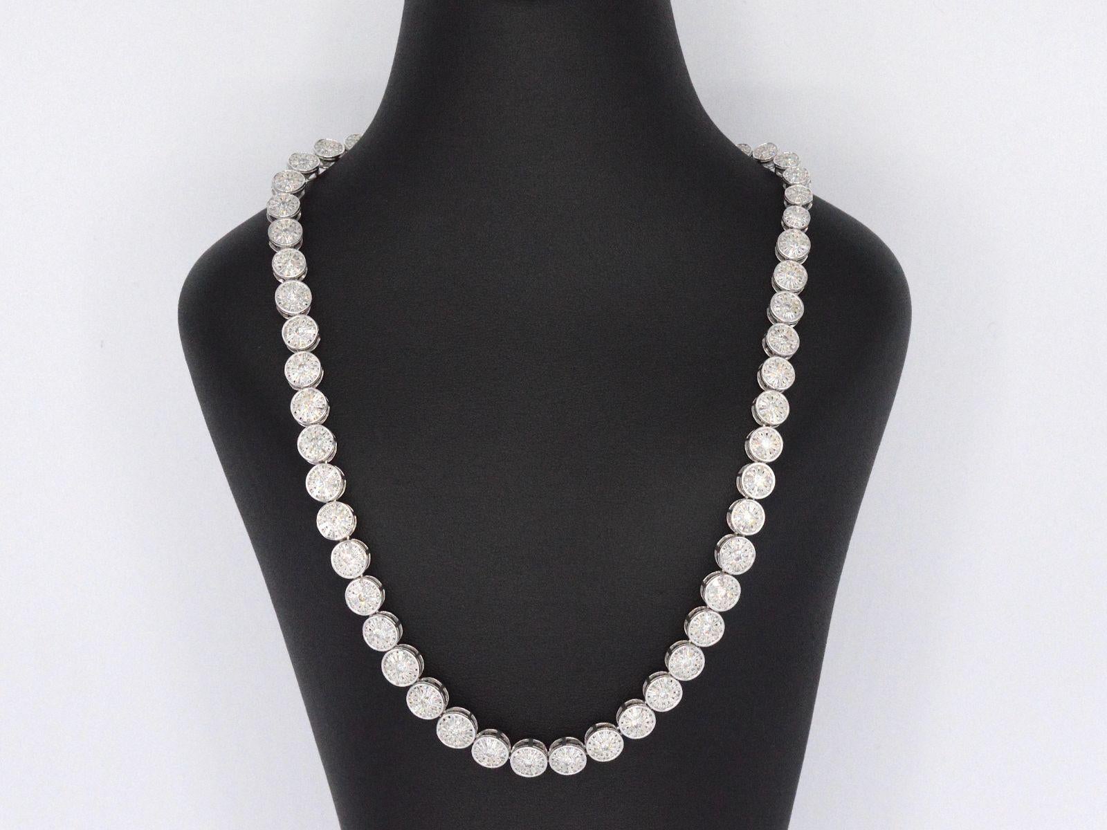 This white gold necklace is an absolute must-have for anyone who loves luxurious and stunning jewelry. It features an exquisite design that showcases 15.00 carats of brilliant and baguette-cut diamonds, arranged in a breathtaking pattern that