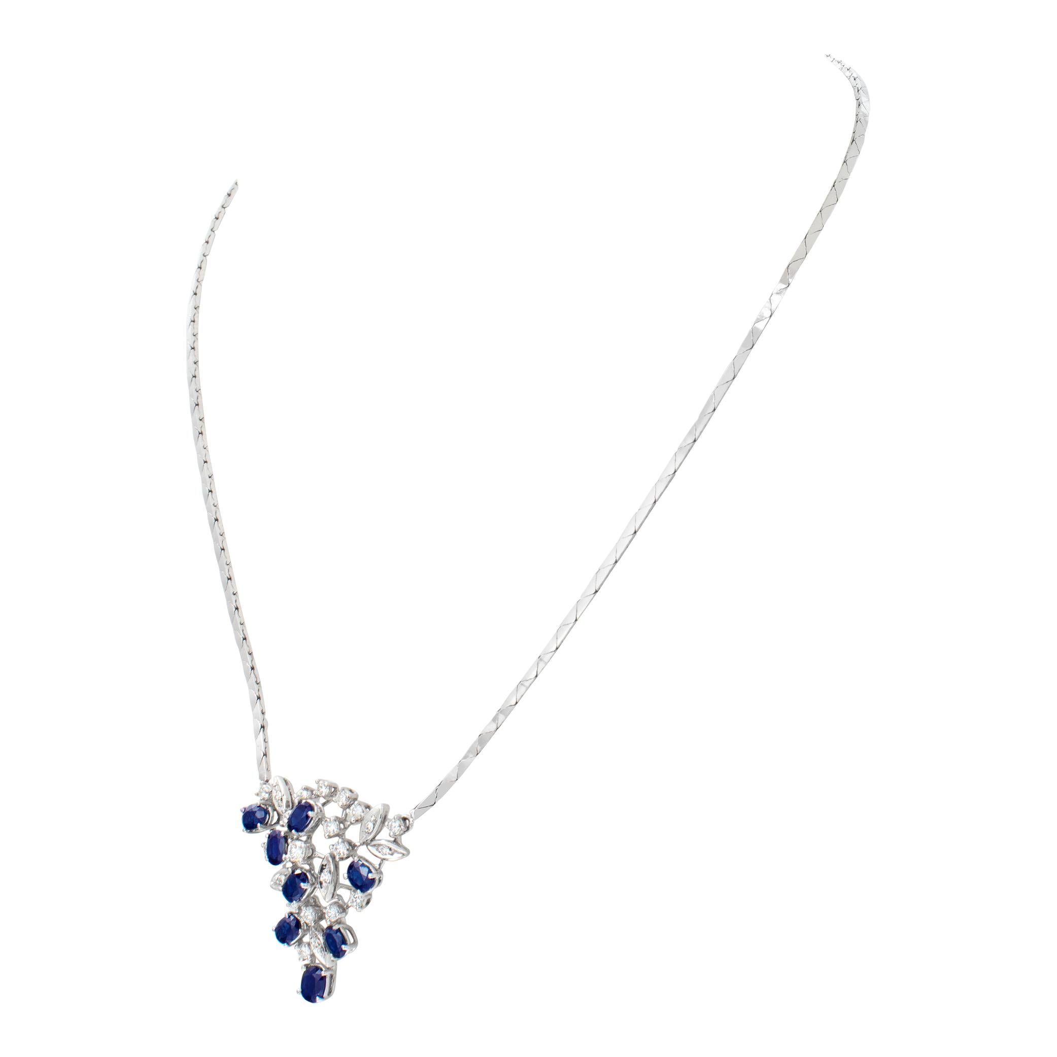 Drop pendant necklace in 18k white gold with diamonds and sapphires, with approx. 2.50 carats in blue sapphires and 1 carat in round diamonds G-H color, VS-SI clarity. Length 16 inches.
