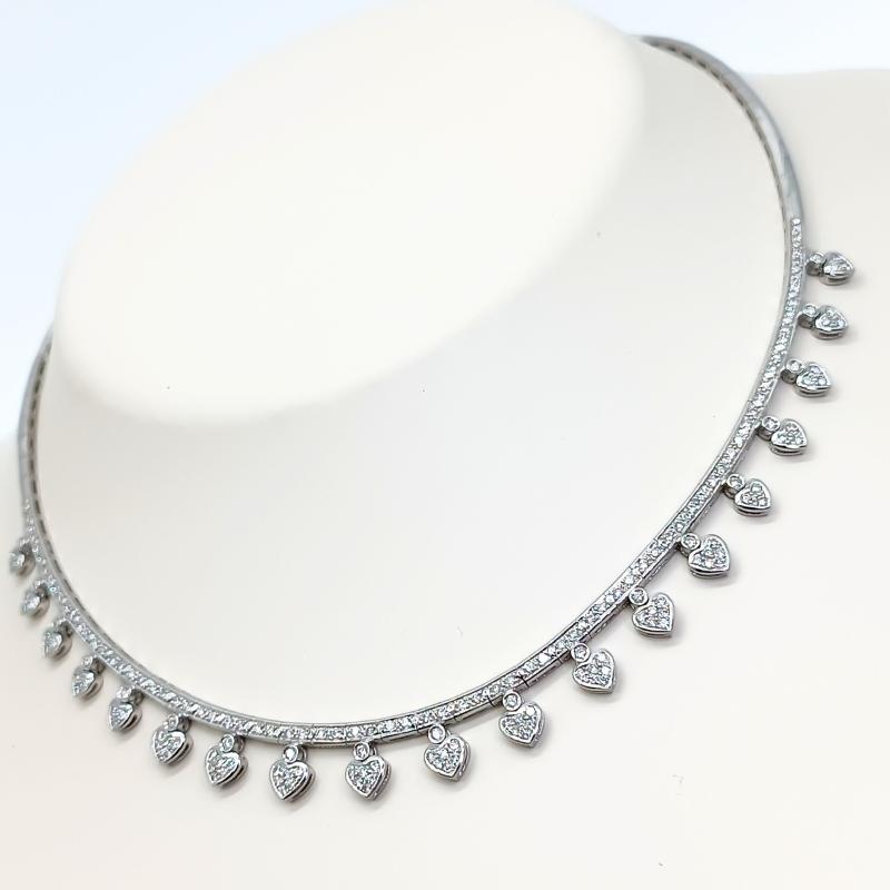 White Gold necklace with 19 heart shaped pendants with brilliant- cut diamonds.

18k White Gold
Diamonds: 2.04k 