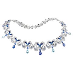 Collier en or blanc avec diamants blancs, tanzanite, aigue-marine et saphir bleu