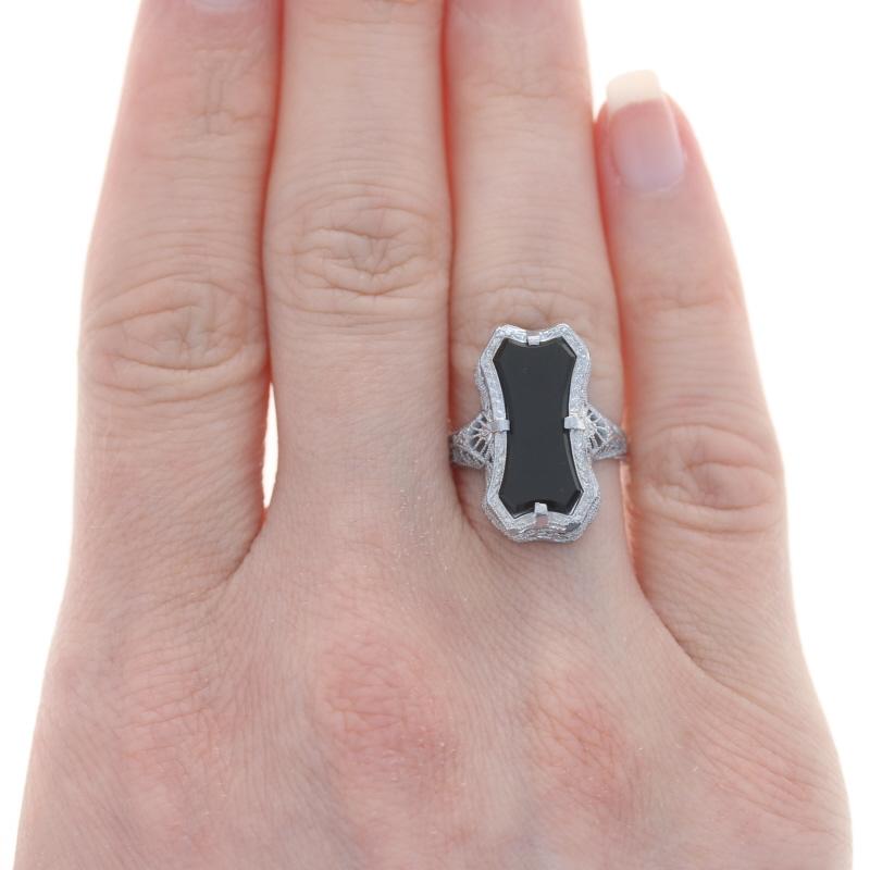 Size: 5 1/2
Sizing Fees: Down 1 or up 2 for $35

Metal Content: 14k White Gold

Stone Information

Natural Onyx
Color: Black

Style: Cocktail Solitaire 
Design: Art Deco-Inspired Style
Features:  Filigree design with etched & milgrain