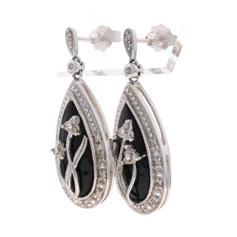 Metal Content: 10k White Gold

Stone Information
Natural Onyx
Color: Black

Natural Diamonds
Carat(s): .09ctw
Cut: Single
Color: I - J
Clarity: SI2 - I1

Style: Dangle
Fastening Type: Butterly Closures
Theme: Flowers
Features: Milgrain