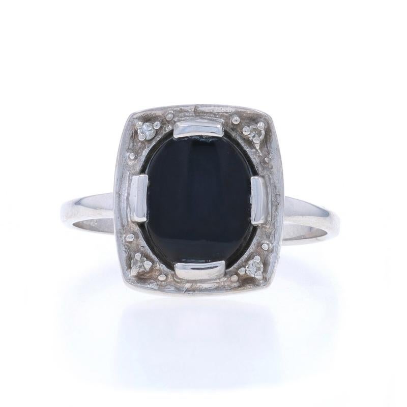 Size: 7 3/4
Sizing Fee: Up 3 sizes for $35 or Down 2 sizes for $35

Era: Vintage

Metal Content: 14k White Gold

Stone Information

Natural Onyx
Cut: Oval Cabochon
Color: Black

Natural Diamonds
Cut: Single
Stone Note: (four small accents)

Style: