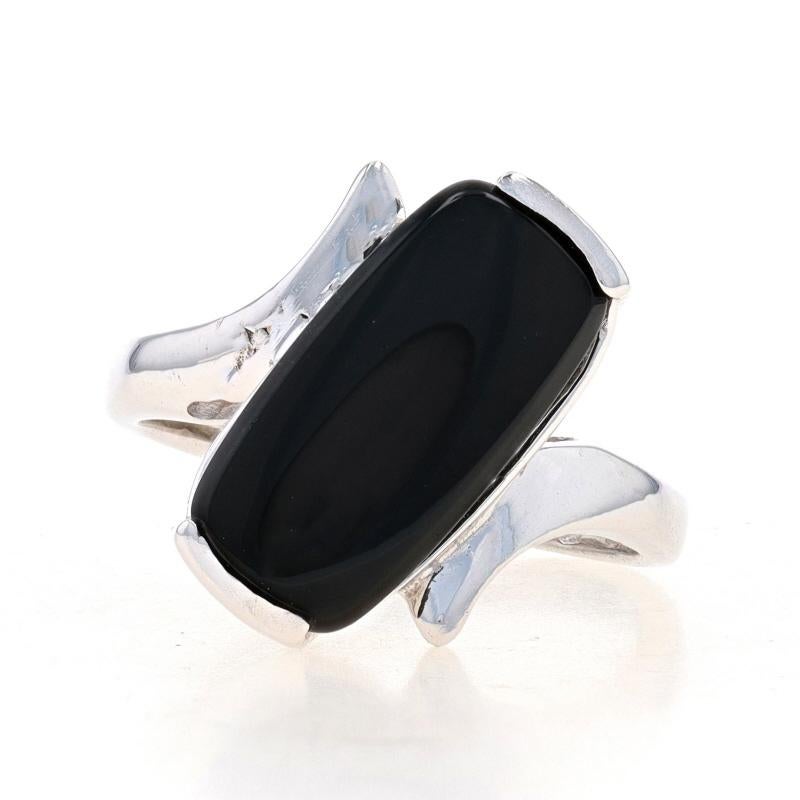 Size: 4
Sizing Fee: Up 1 1/2 sizes for $35 or Down 1/2 a size for $25

Metal Content: 10k White Gold

Stone Information
Natural Onyx
Color: Black

Style: Solitaire Bypass

Measurements
Face Height (north to south): 19/32