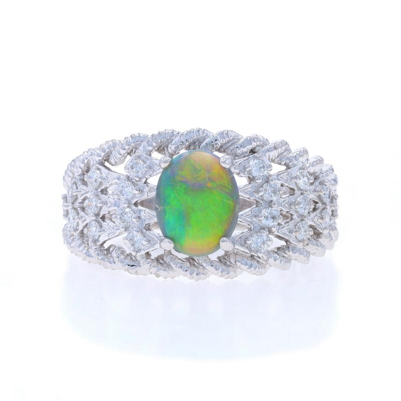 Size: 7
Sizing Fee: Up 2 sizes for $60 or Down 1 size for $40

Metal Content: 14k White Gold

Stone Information

Natural Opal
Carat(s): .78ct
Cut: Oval Cabochon
Color: Black
Origin: Australian

Natural Diamonds
Carat(s): .30ctw
Cut: Round