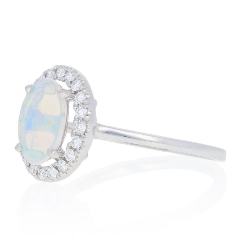 Oval Cut White Gold Opal and Diamond Ring, 14 Karat Oval Cabochon Cut .53 Carat Halo