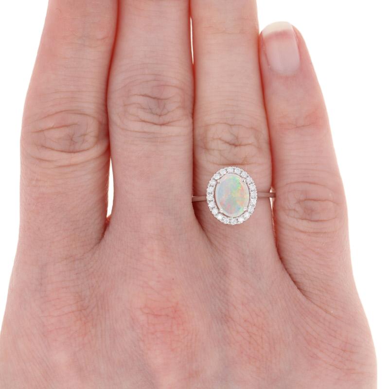 White Gold Opal and Diamond Ring, 14 Karat Oval Cabochon Cut .53 Carat Halo In New Condition In Greensboro, NC