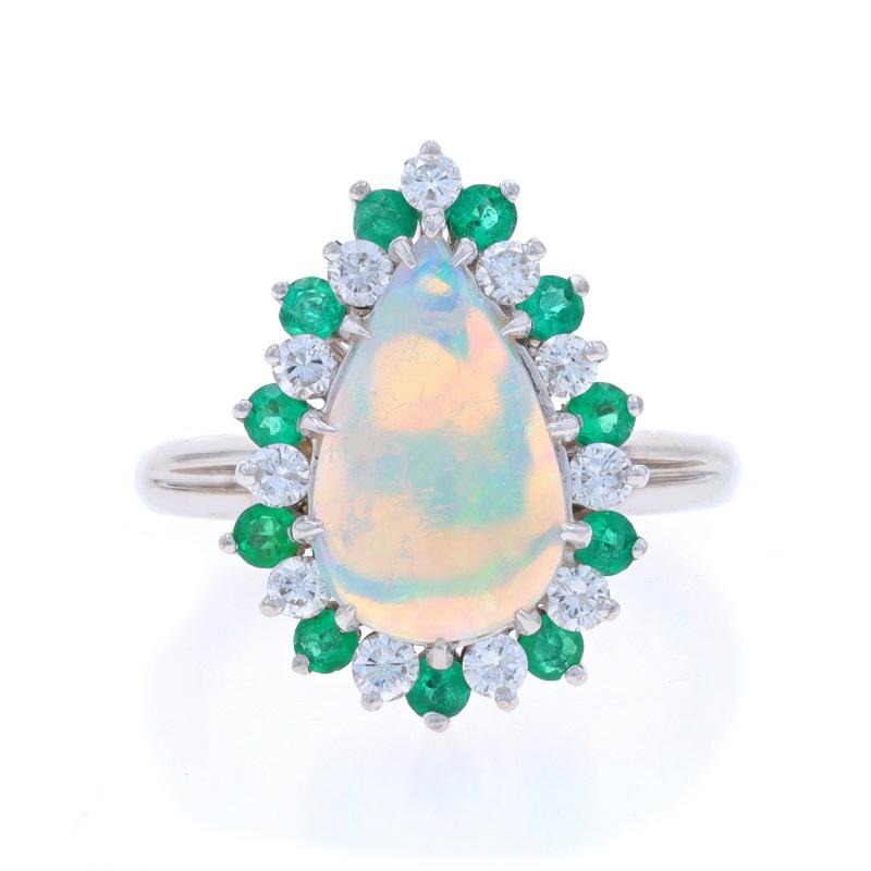 Size: 6 1/2
Sizing Fee: Up 2 sizes for $40 or Down 1 1/2 sizes for $40

Metal Content: 14k White Gold

Stone Information

Natural Opal
Carat(s): 1.60ct
Cut: Pear Cabochon

Natural Emeralds
Treatment: Oiling
Carat(s): .66ctw
Cut: Round
Color: