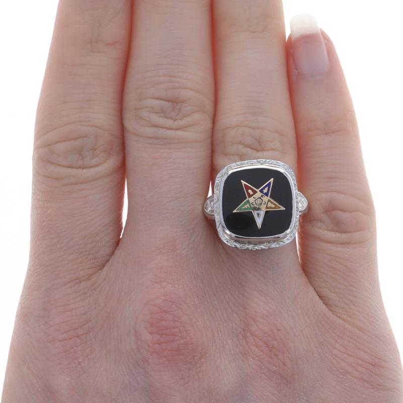 Size: 8 1/4
Sizing Fee: Up 2 sizes for $35

Organization: Order of the Eastern Star
Era: Vintage

Metal Content: 14k White Gold & 14k Yellow Gold

Stone Information
Natural Onyx
Color: Black

Material Information
Enamel
Color: Black, Blue, Yellow,